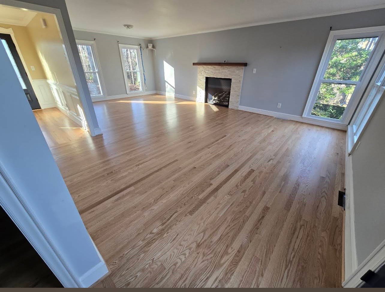 New hardwood floor installation in open living room – Davidson NC